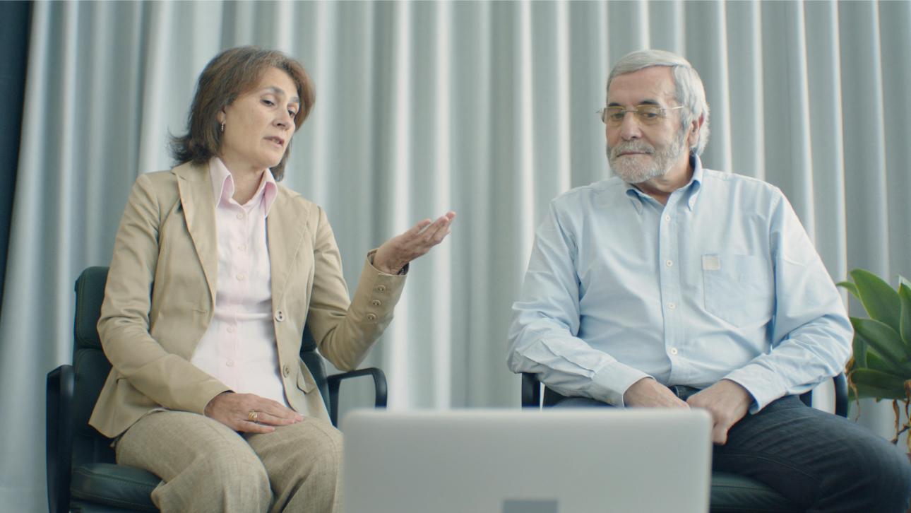 Two people discussing in person