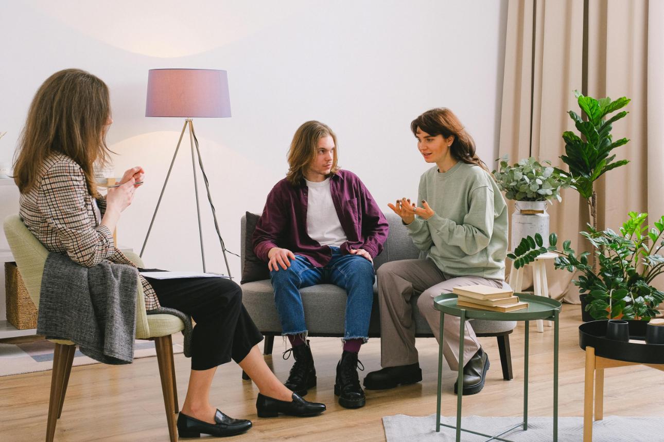 Counseling session with three individuals