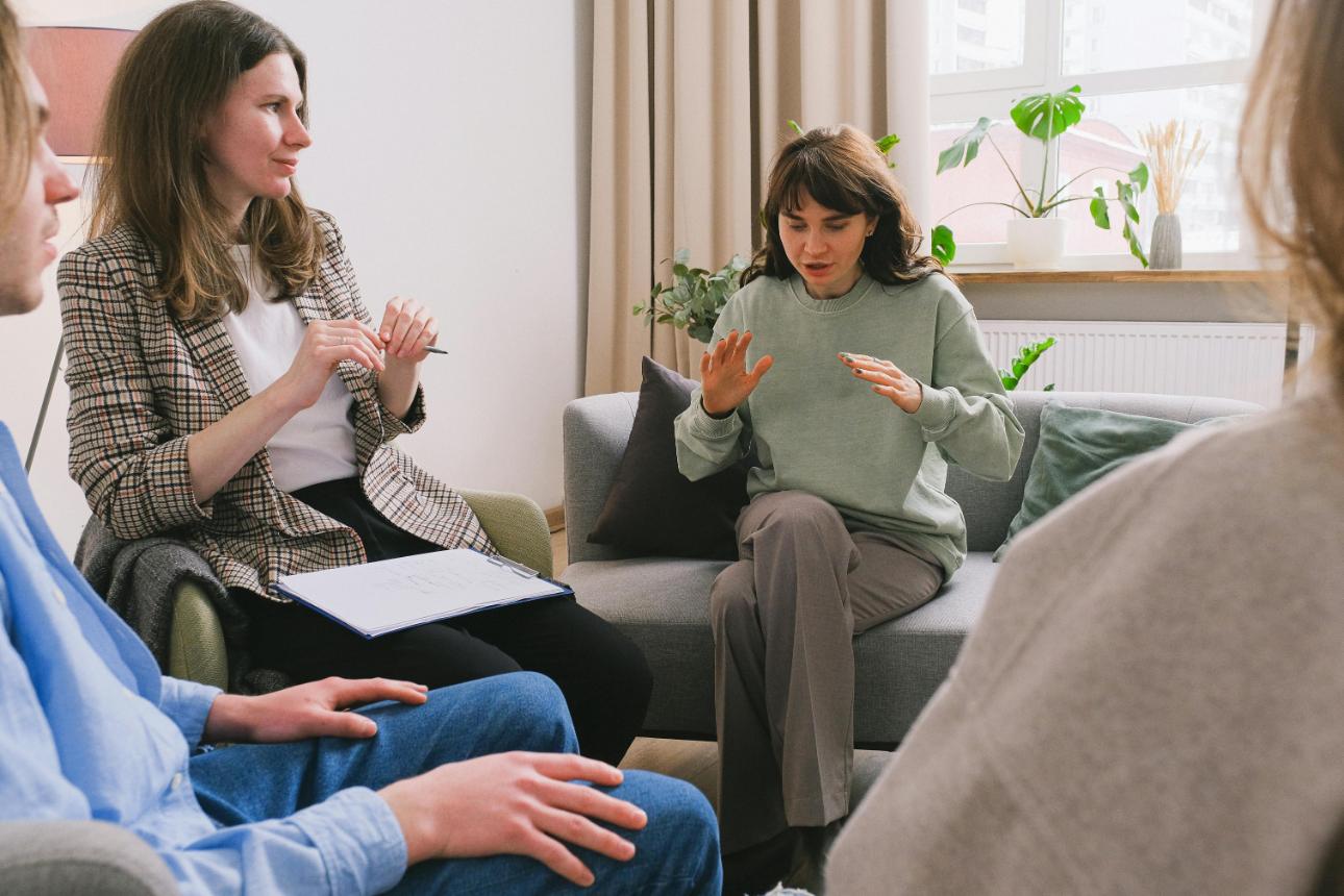 Counseling session with three individuals